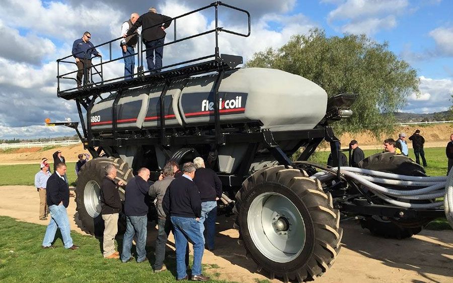A Flexi-Coil dealer demonstrates an air seeder to customers