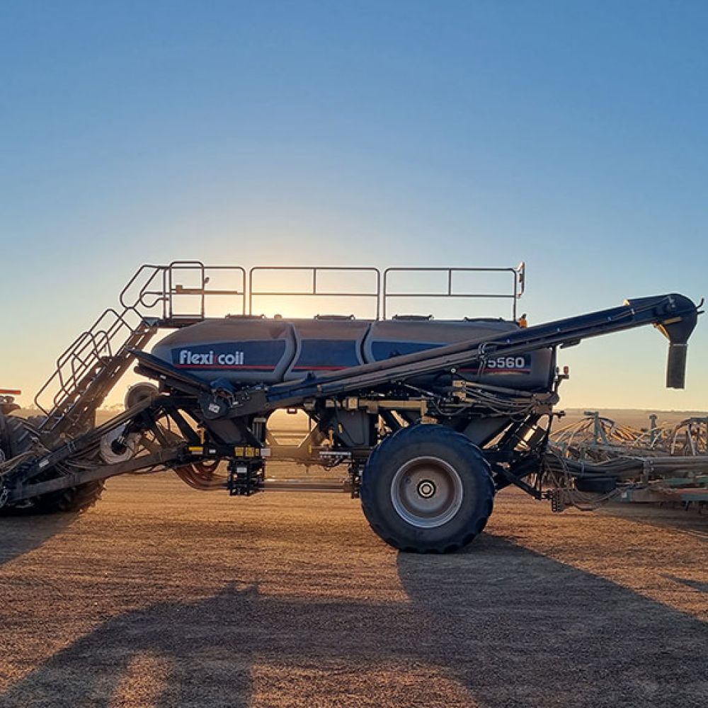 A Flexi-Coil 60 Series Aircart with the sun behind it on the Lynch family farm in WA